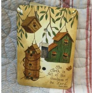 Single light switch plate with birdhouses.